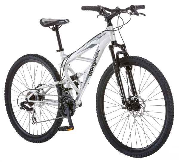 91jcf8cHO5L Conquer any trail with the Mongoose Impasse Mountain Bike. Featuring an 18" aluminum frame, 29" wheels, and 21-speed twist shifters, this bike offers comfort and control. The front suspension fork smooths bumps, while the disc brakes ensure reliable stopping power. Ideal for riders 5'4" to 6'2".