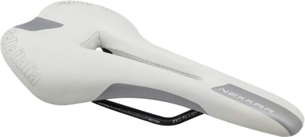 Selle Italia Nekkar Flow Saddle FEC White 134mm x 280mm Experience comfort and performance with the Selle Italia Nekkar Flow Saddle. Ideal for road or mountain riding, this saddle features extra padding, an anatomic cutout for pressure relief, and durable FEC alloy rails. Made in Italy, lightweight at 310g. Available in White.