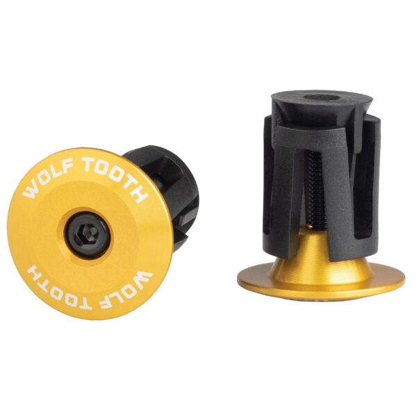 Wolf Tooth Alloy Bar End Plugs Set of 2 Gold Add a flash of color to your handlebars with these precision-engineered Alloy Bar End Plugs. Compatible with mountain and road bike handlebars, the expanding wedge ensures a secure fit for most inner bar diameters. Made from lightweight and durable 6061-T6 aluminum, these plugs are available in various anodized color options that match other Wolf Tooth accessories.